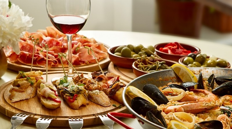 Assortment of Italian food that is not pizza or pasta. Includes wine and small appetizers.