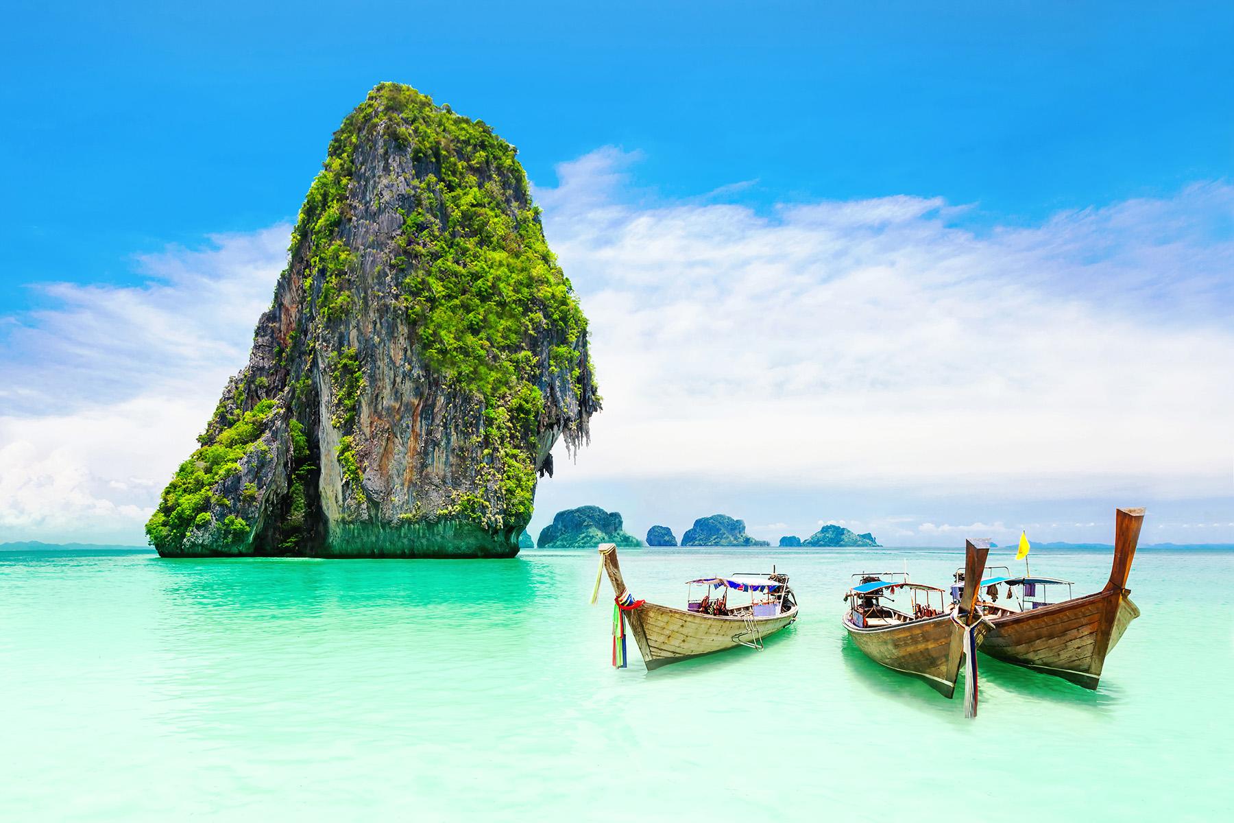 View of hidden Thailand beach with boats.