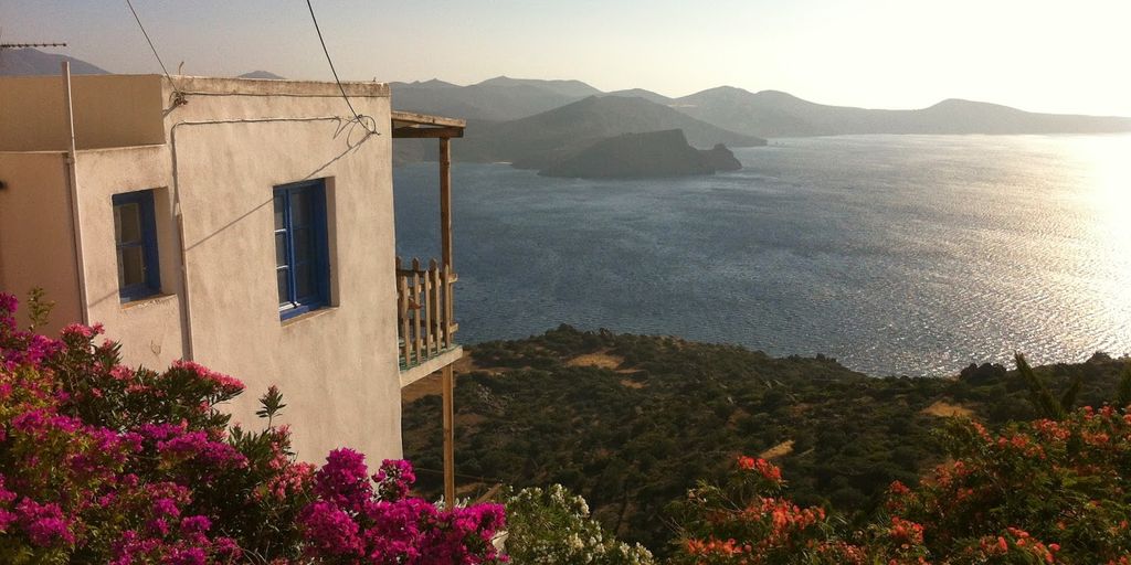 beautiful beach in Greece with tourists enjoying vacation